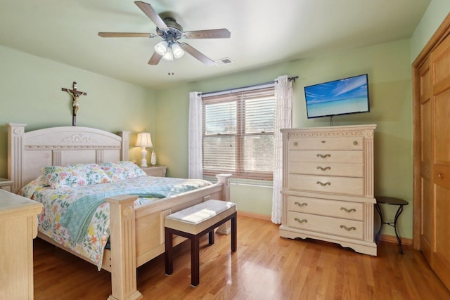 5326 S Nagle Ave, Chicago, IL 60638 - bedroom featuring ceiling fan, light wood finished floors, visible vents, and baseboards