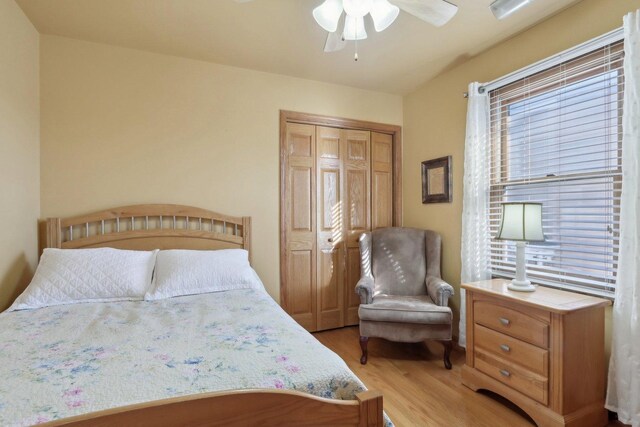 5326 S Nagle Ave, Chicago, IL 60638 - bedroom with light wood-type flooring, ceiling fan, and a closet