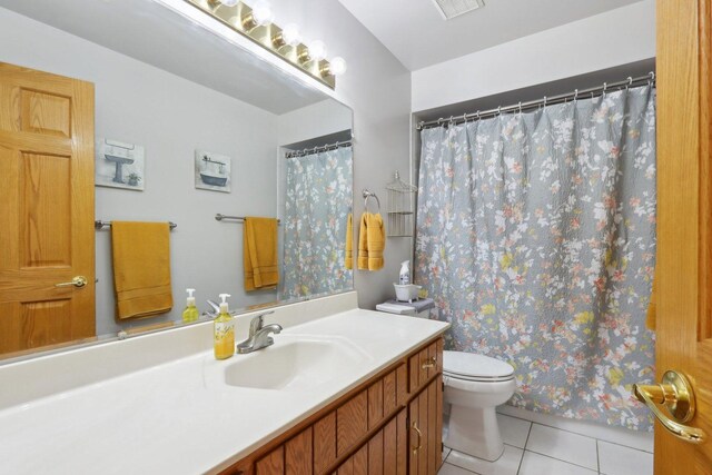 5326 S Nagle Ave, Chicago, IL 60638 - bathroom featuring vanity, a shower with shower curtain, tile patterned flooring, and toilet