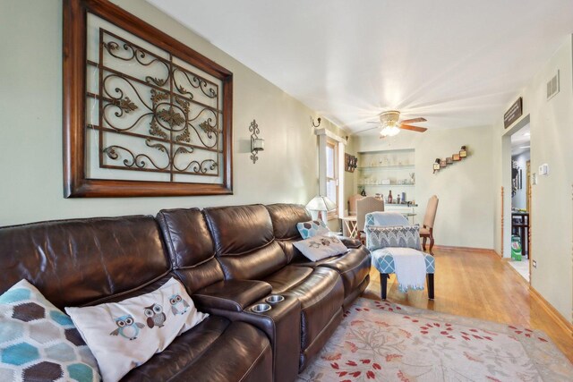 5326 S Nagle Ave, Chicago, IL 60638 - living room with built in features, ceiling fan, visible vents, and wood finished floors