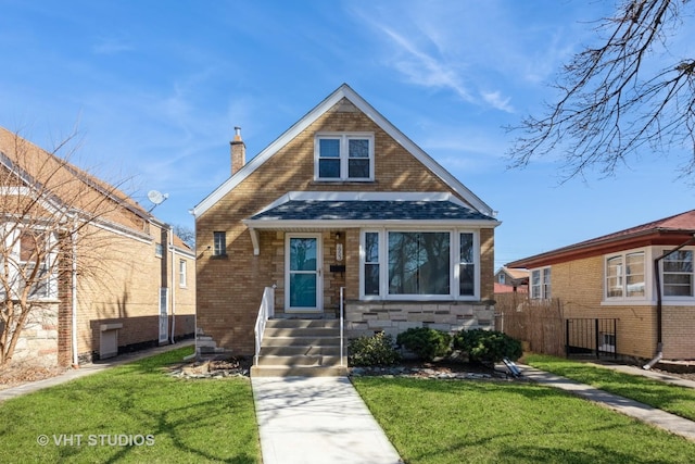 bungalow-style house featuring a front yard, fence, a shingled roof, a chimney, and brick siding