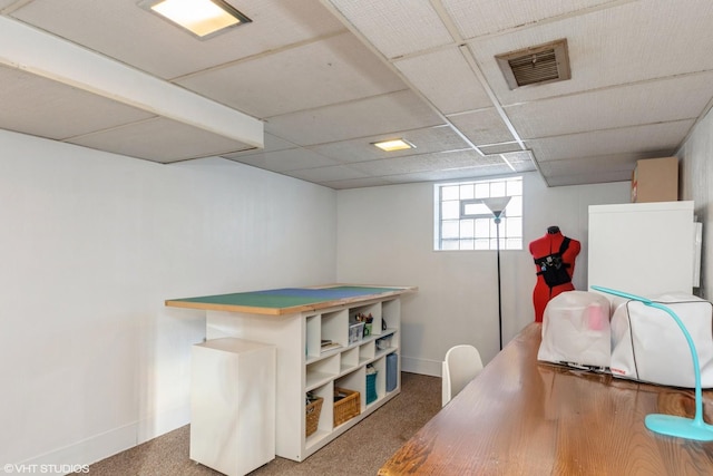 interior space with carpet, a paneled ceiling, visible vents, and baseboards