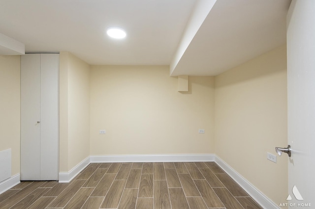 finished basement with baseboards and wood tiled floor