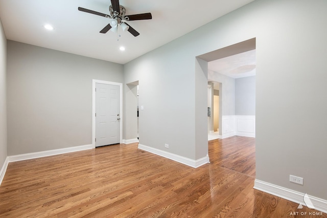 empty room featuring ceiling fan, recessed lighting, light wood-style flooring, and baseboards