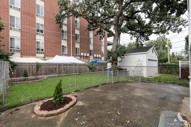 view of yard with a garage and fence