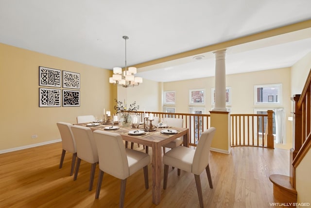 dining space with light wood-style floors, plenty of natural light, and baseboards