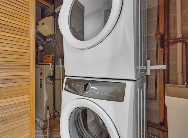 laundry room featuring stacked washer and clothes dryer