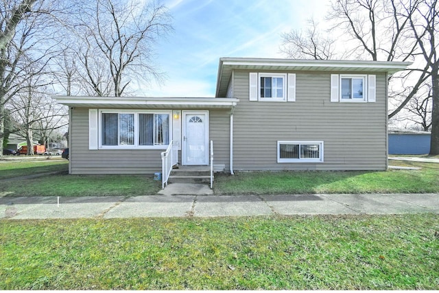 tri-level home featuring a front yard