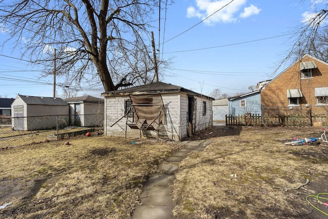 view of shed featuring fence