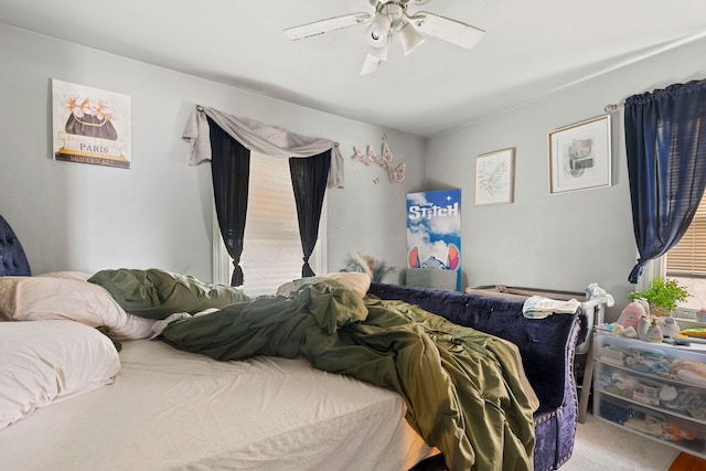 carpeted bedroom featuring a ceiling fan