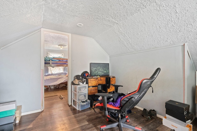 office with vaulted ceiling, a textured ceiling, baseboards, and wood finished floors