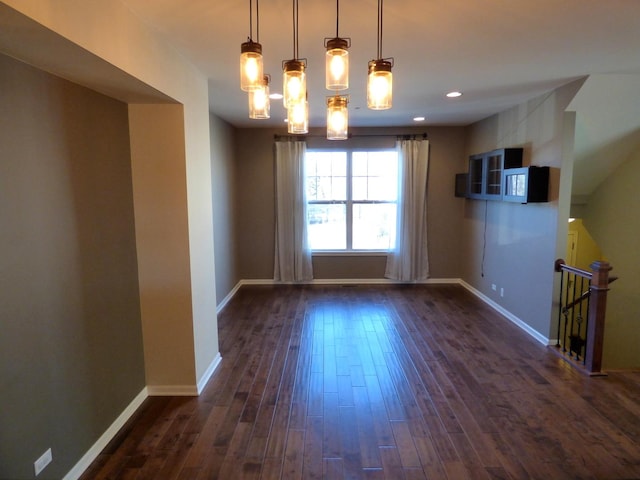 interior space featuring baseboards, dark wood-style flooring, and recessed lighting