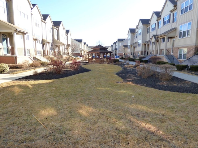 surrounding community featuring a residential view, a lawn, and a gazebo