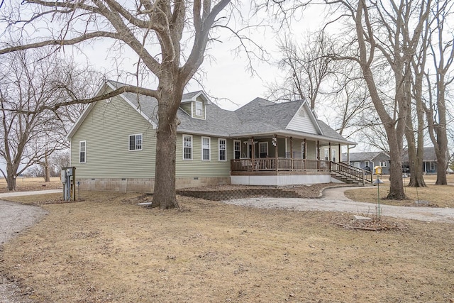 exterior space featuring crawl space, covered porch, and roof with shingles