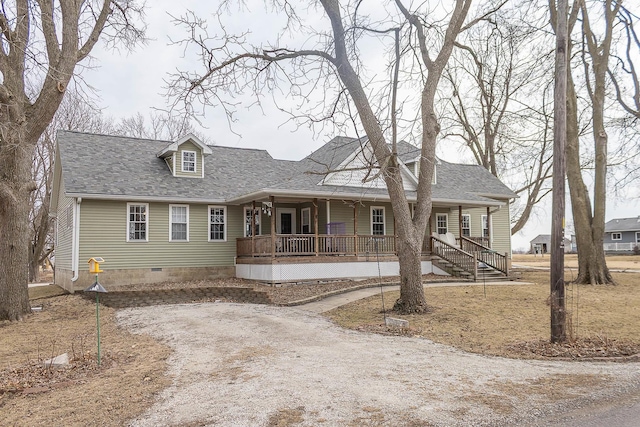 view of front facade with covered porch, dirt driveway, a shingled roof, and crawl space