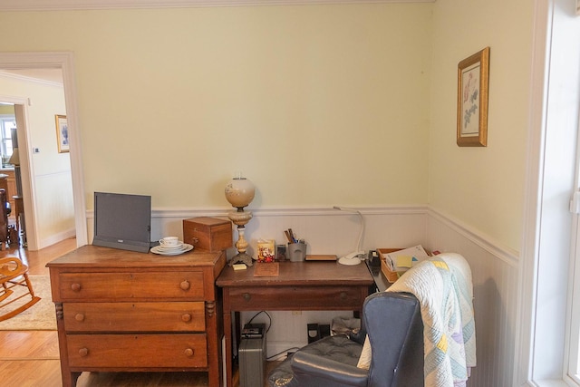 office space featuring a wainscoted wall and wood finished floors