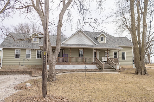 view of front of property with a porch and roof with shingles