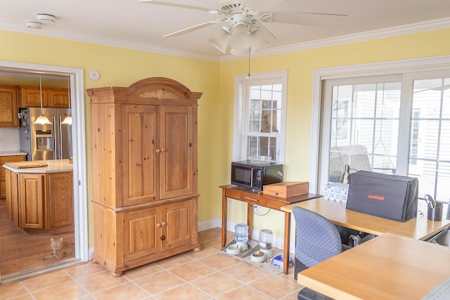 office space featuring ceiling fan, ornamental molding, a wealth of natural light, and light tile patterned flooring