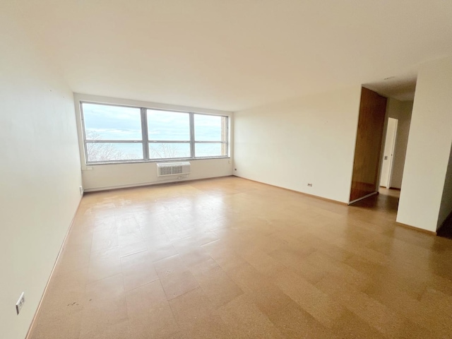 5532 S Shore Dr Unit 6E, Chicago, IL 60637 - spare room featuring a wall mounted AC and light floors