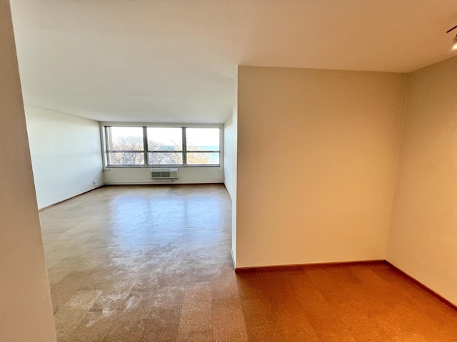 5532 S Shore Dr Unit 6E, Chicago, IL 60637 - spare room with a wall unit AC and carpet floors