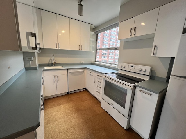 5532 S Shore Dr Unit 6E, Chicago, IL 60637 - kitchen with white appliances, white cabinetry, and tile patterned floors