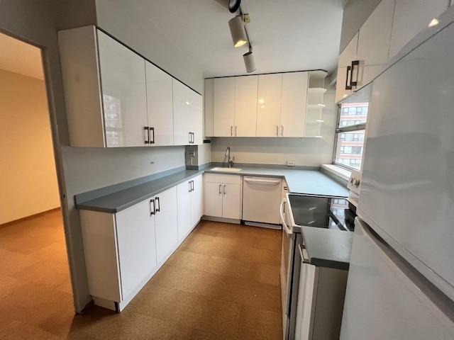 5532 S Shore Dr Unit 6E, Chicago, IL 60637 - kitchen with white appliances, open shelves, white cabinetry, tile patterned floors, and track lighting