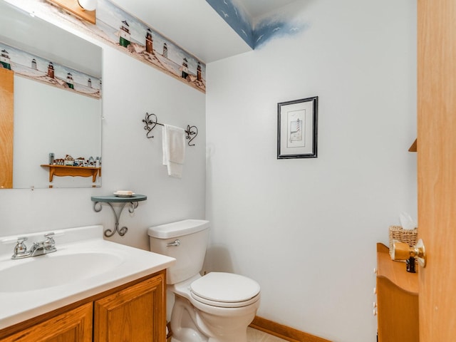 bathroom with toilet and vanity