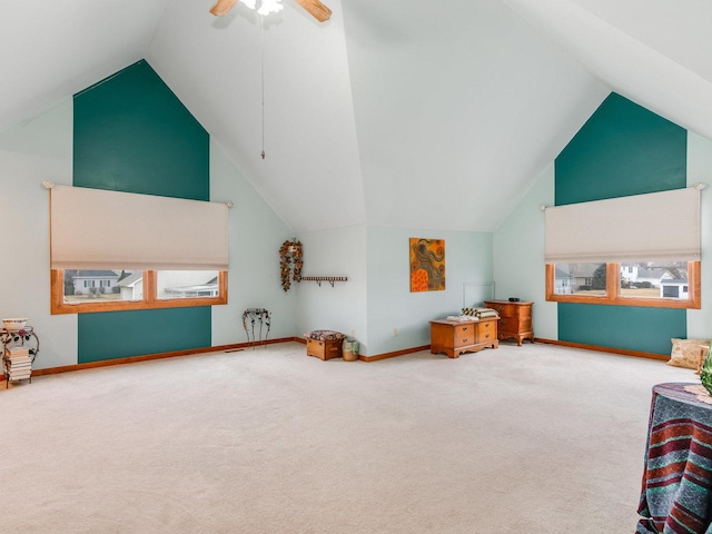 playroom featuring high vaulted ceiling, carpet flooring, a ceiling fan, and baseboards