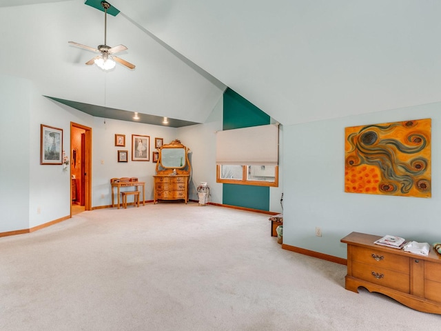 interior space with high vaulted ceiling, carpet, baseboards, and ceiling fan