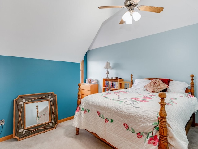 carpeted bedroom featuring vaulted ceiling, a ceiling fan, and baseboards