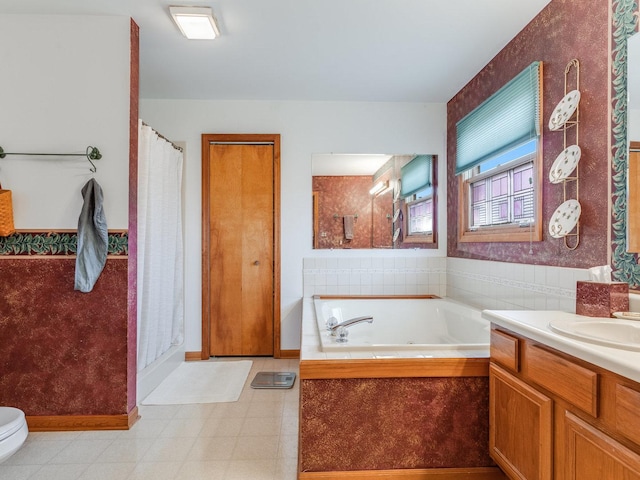 full bath featuring tile patterned floors, toilet, vanity, a shower with curtain, and a bath