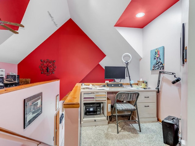 office space featuring vaulted ceiling, carpet, and a ceiling fan