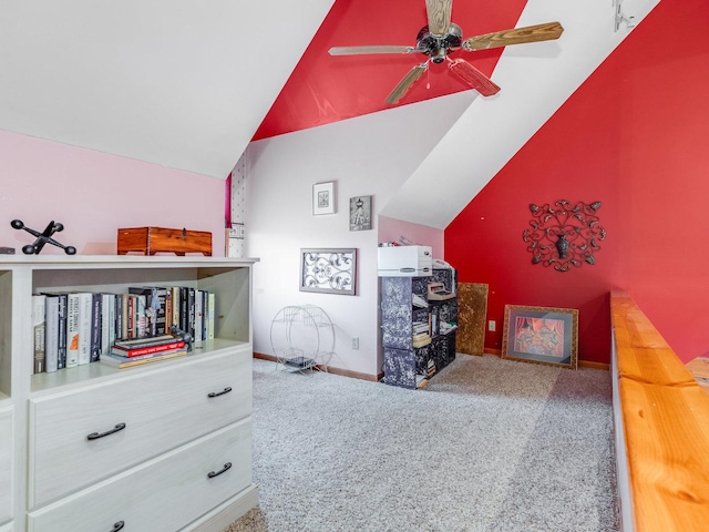 carpeted bedroom with lofted ceiling, ceiling fan, and baseboards