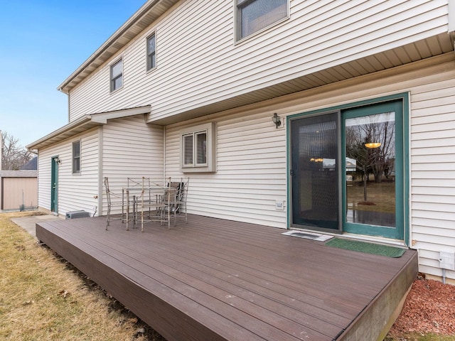 wooden terrace with outdoor dining space