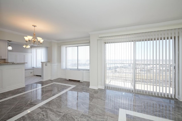 interior space featuring marble finish floor, a decorative wall, radiator heating unit, an inviting chandelier, and ornamental molding