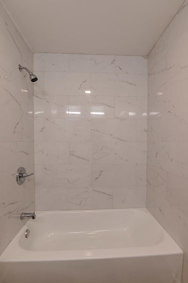 full bathroom with shower / tub combination