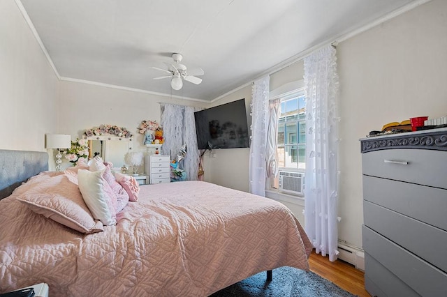 bedroom featuring a baseboard heating unit, ornamental molding, ceiling fan, wood finished floors, and cooling unit