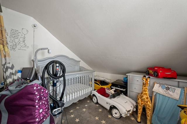 carpeted bedroom with vaulted ceiling