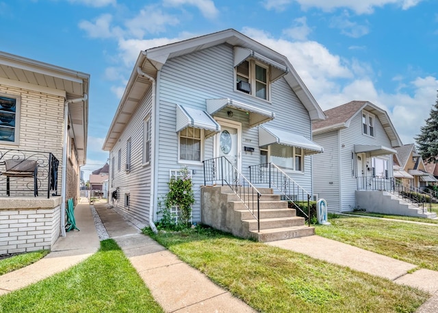 view of front of house with a front lawn and a residential view