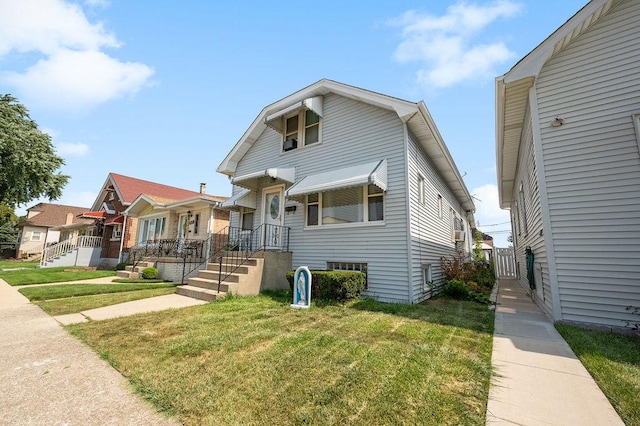 view of front of property featuring a residential view and a front yard