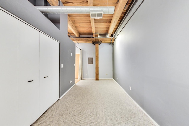 bedroom featuring light colored carpet, visible vents, baseboards, a closet, and electric panel