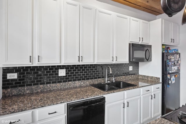 kitchen with black appliances, a sink, and white cabinetry