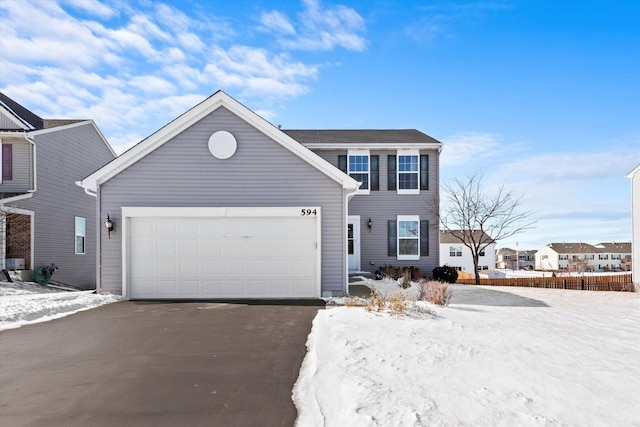 view of front of house featuring aphalt driveway and an attached garage