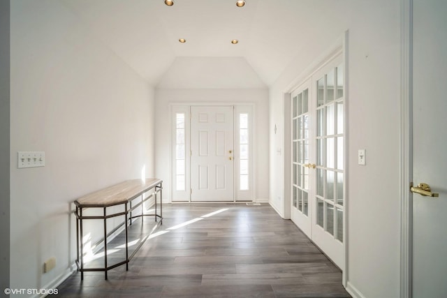 foyer entrance featuring lofted ceiling, baseboards, dark wood-type flooring, and recessed lighting