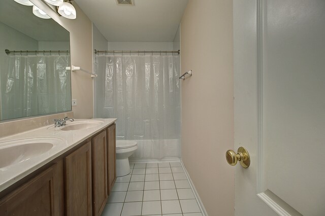 26403 W Red Apple Rd, Plainfield, IL 60585 - bathroom featuring tile patterned floors, toilet, baseboards, double vanity, and shower / bath combo