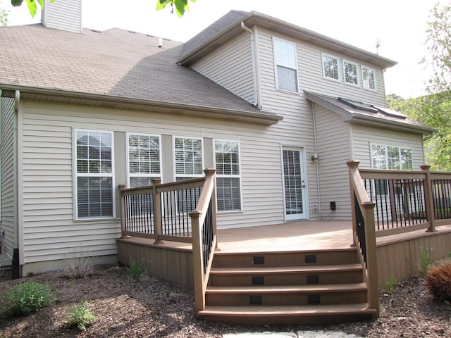 26403 W Red Apple Rd, Plainfield, IL 60585 - rear view of house featuring a chimney, a deck, and roof with shingles