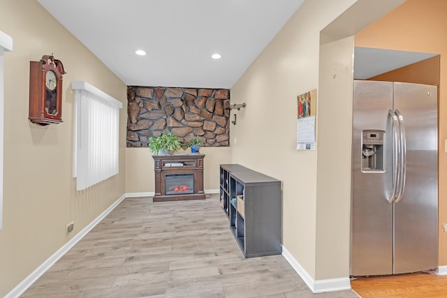 interior space featuring light wood-style floors, recessed lighting, and baseboards