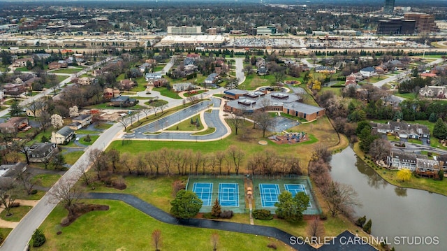 birds eye view of property with a water view
