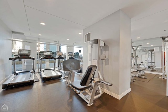 gym featuring recessed lighting and baseboards