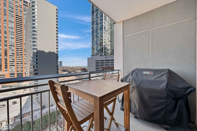 balcony with a grill and a city view